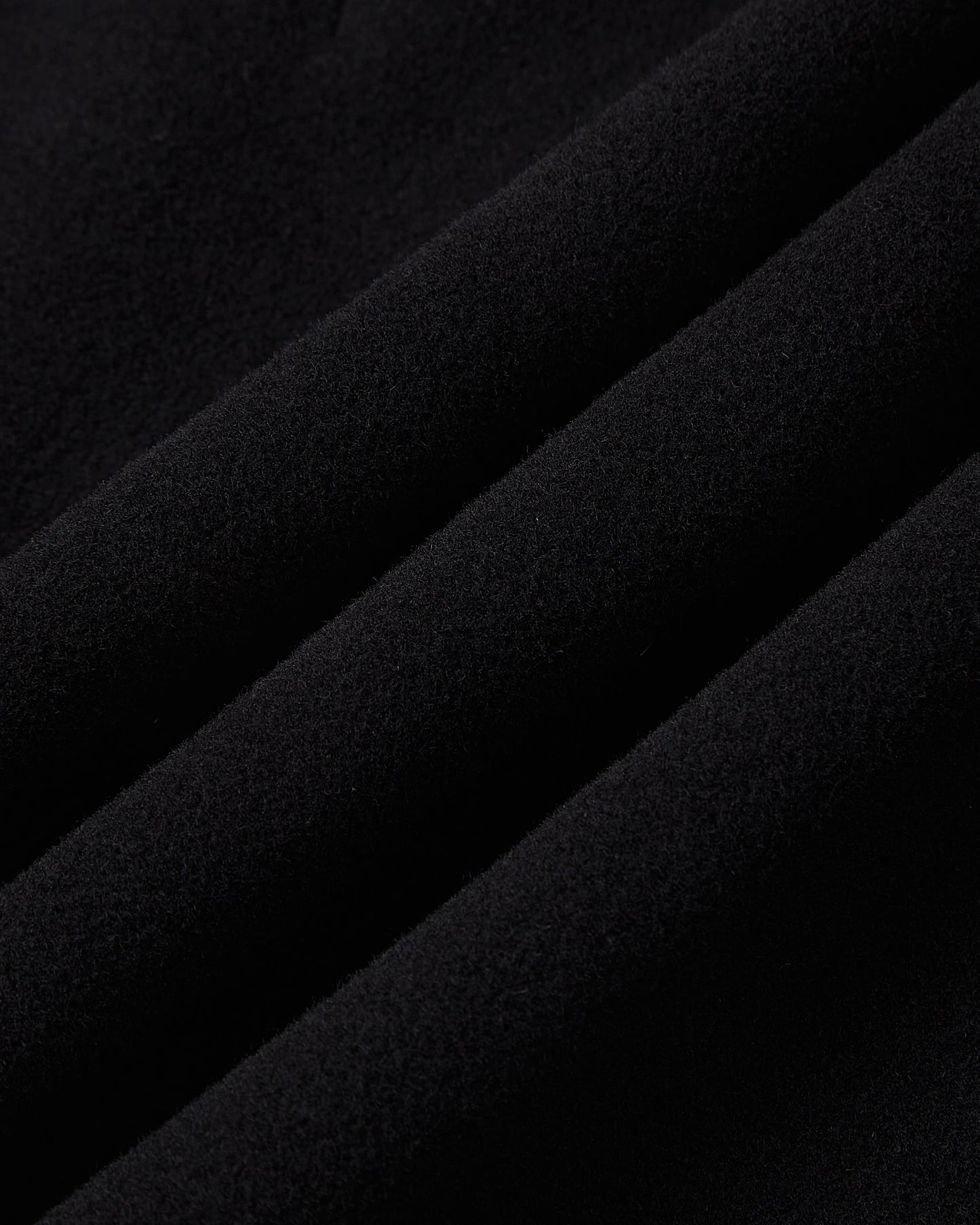 Close up of the soft black wool cashmere cloth