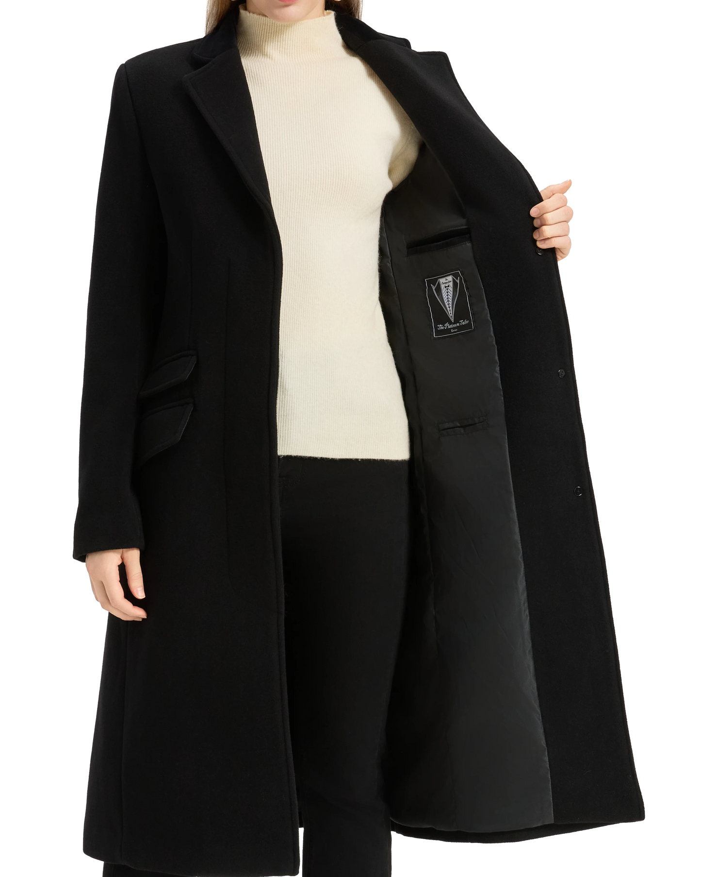 Model holding the black covert overcoat open at the lapel