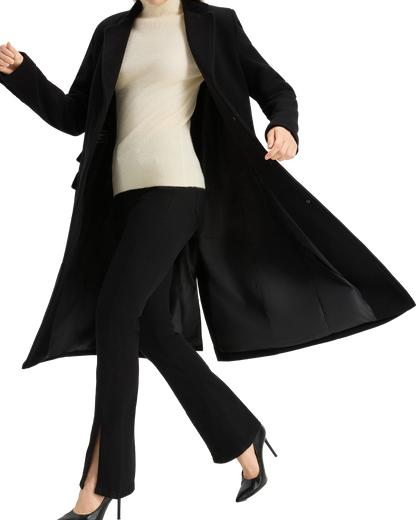 Model wearing the covert overcoat open, showing the black satin lining
