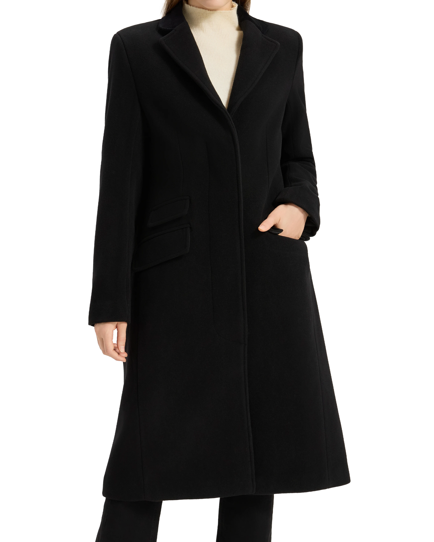 Model with one hand in the pocket of the black covert overcoat