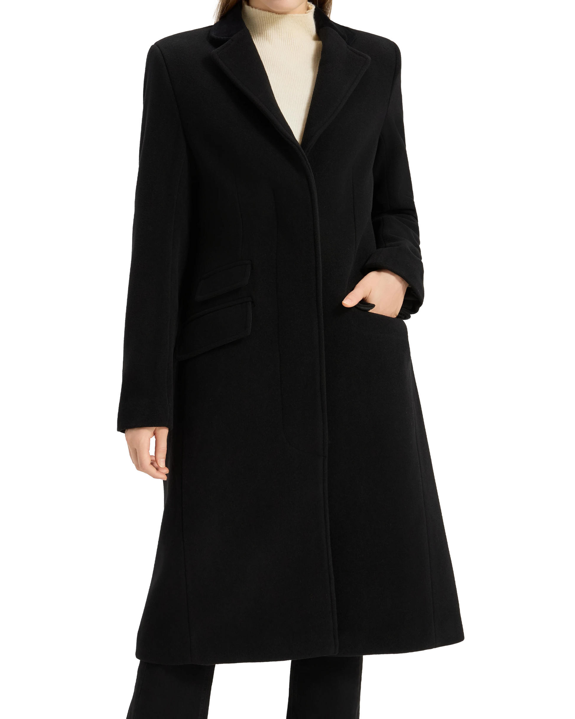 Model with one hand in the pocket of the black covert overcoat