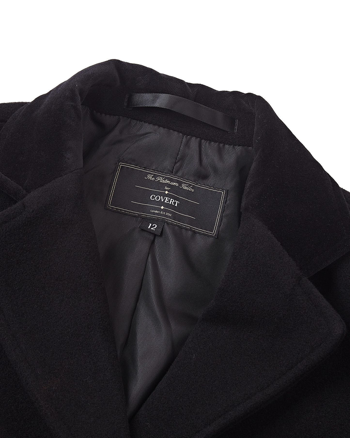 Close up of the inner collar, brand label and black satin lining