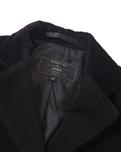 Close up of the inner collar, brand label and black satin lining